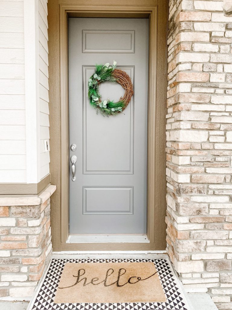 DIY winter wreath at front blue door