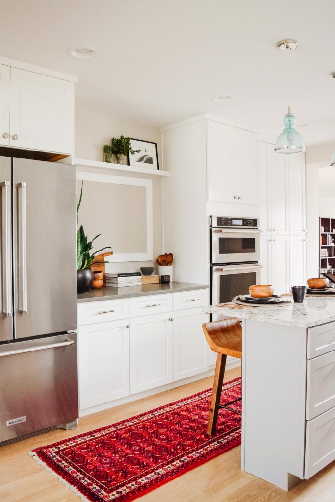 grey kitchen island with granite counter