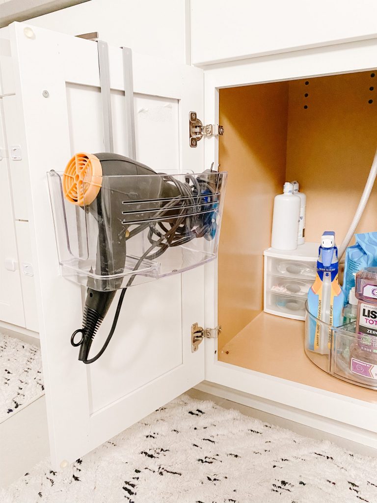 under-sink cabinet with organizers and hair dryer holder