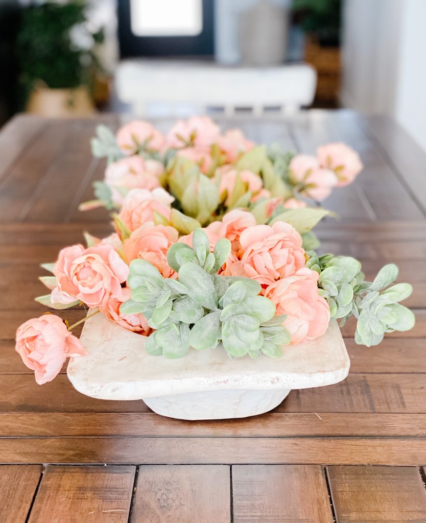 Faux florals in a dough bowl for a pretty centerpiece for spring