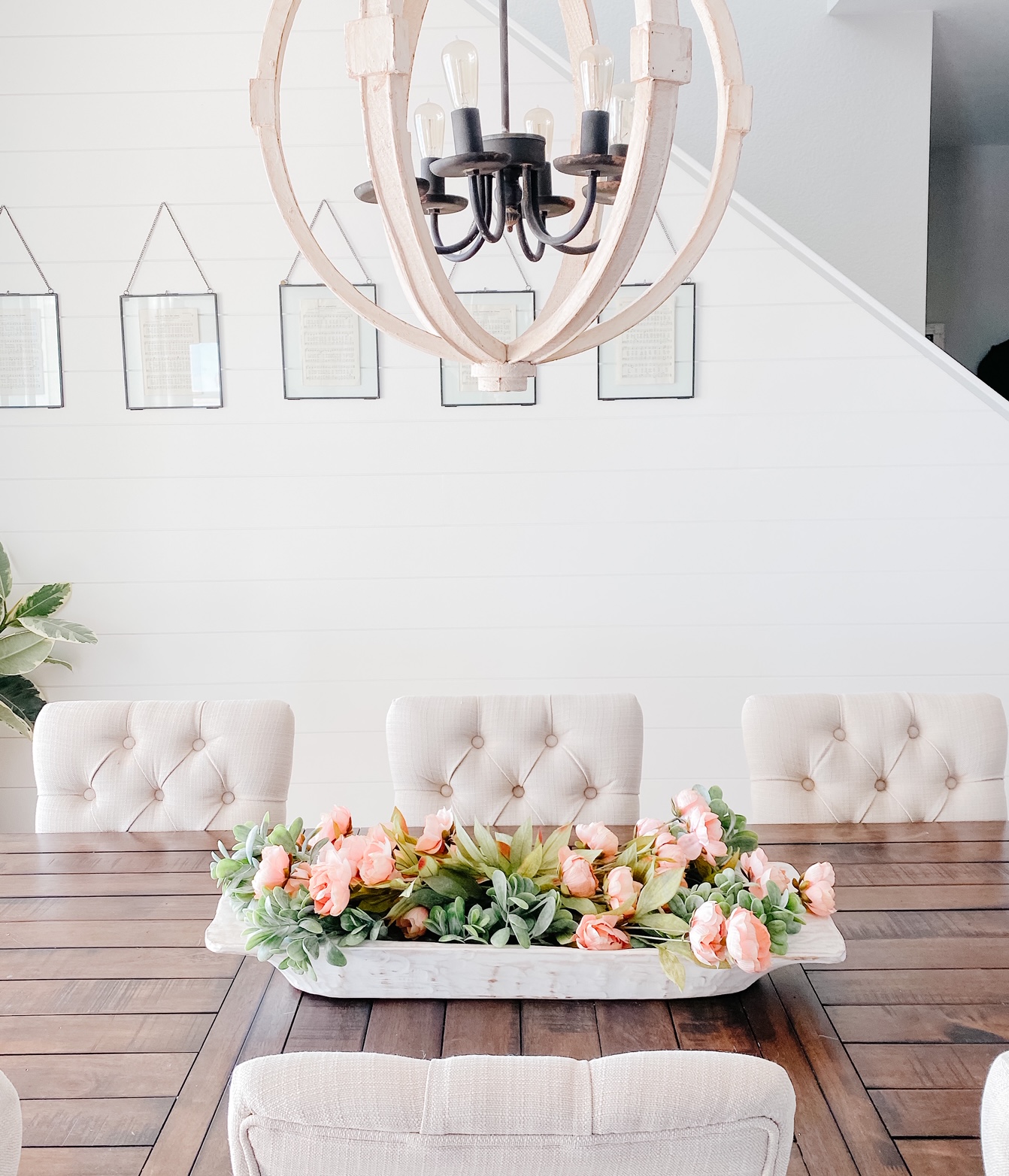 Faux spring florals in a dough bowl makes for a simple dining table centerpiece 