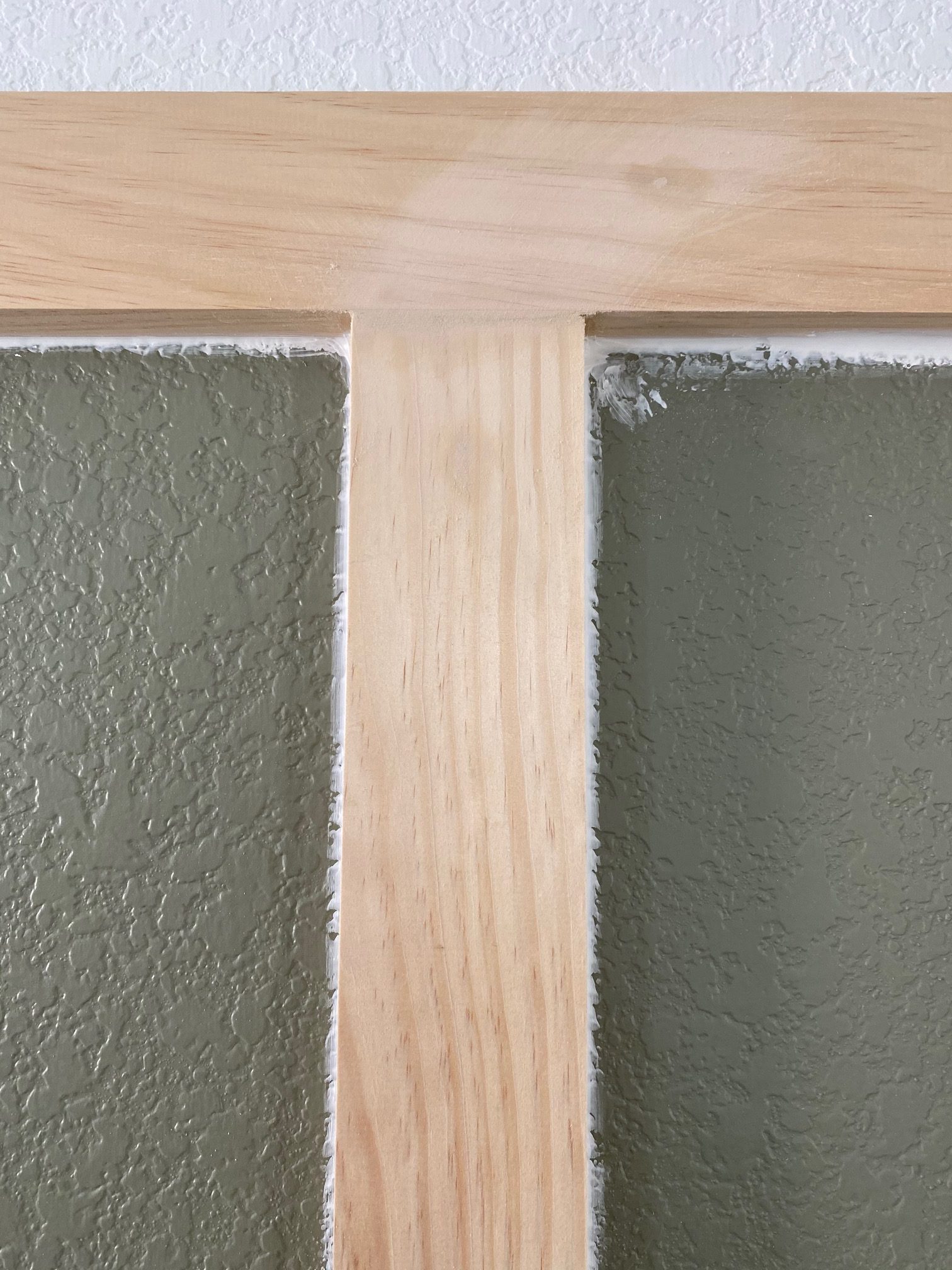 Board and Batten - A simple tutorial on how to DIY board and batten the easy way! Sanding down the spackle 