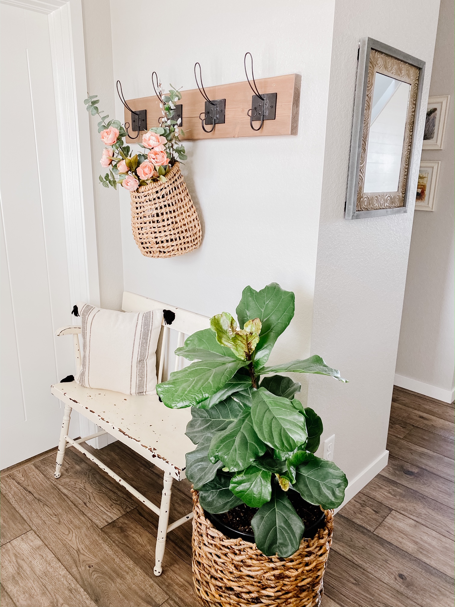 Faux Spring Florals In a hanging basket can add the perfect touch of spring to a coat rack or front door! 