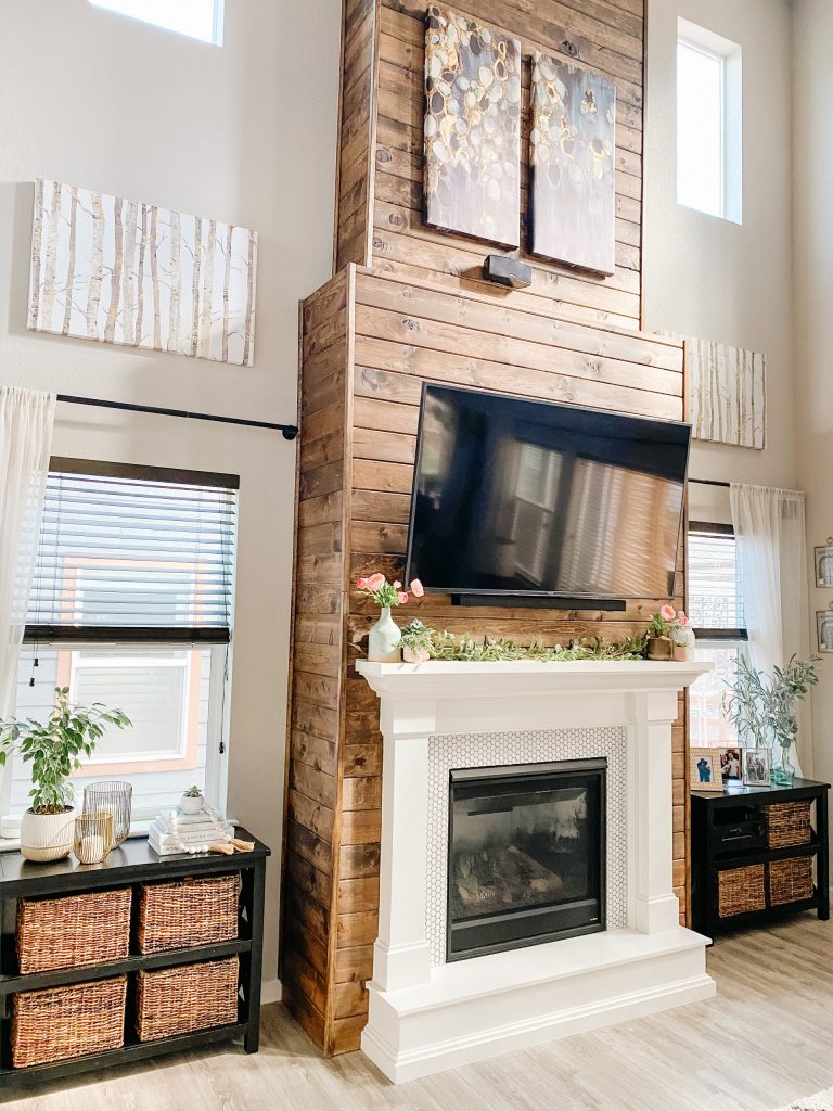 living room fireplace design with stained wood shiplap