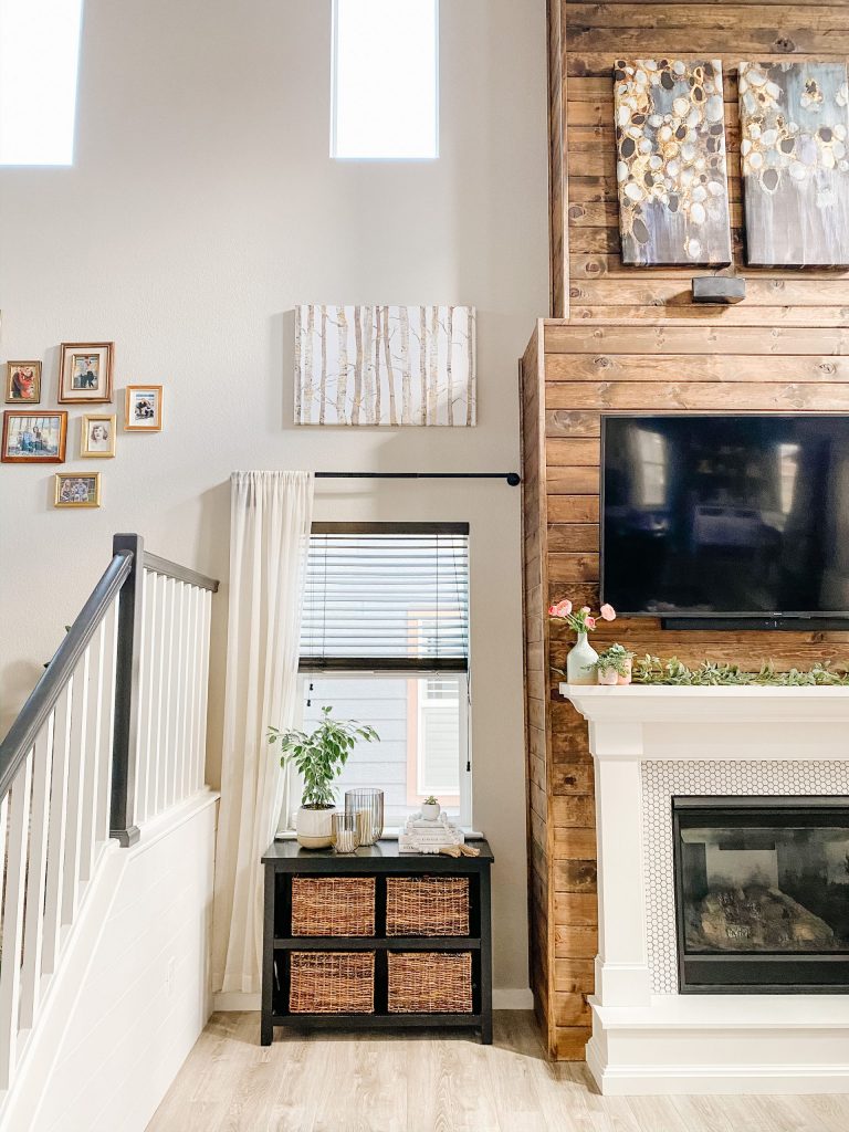 living room fireplace design with stained wood shiplap