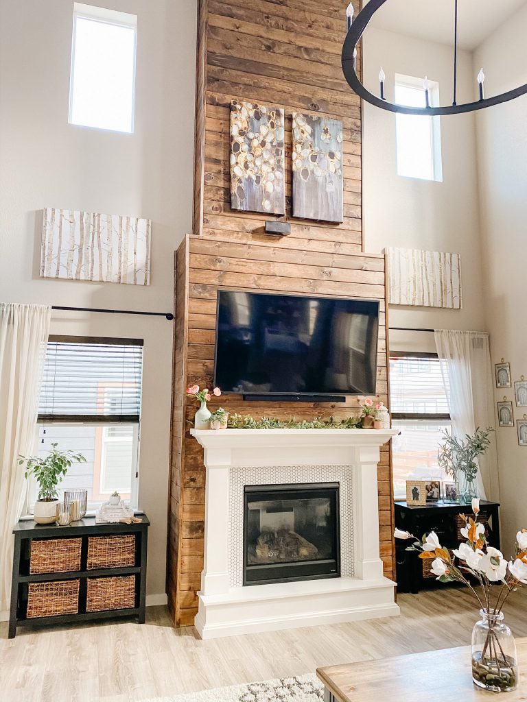 living room fireplace wall design with stained wood shiplap