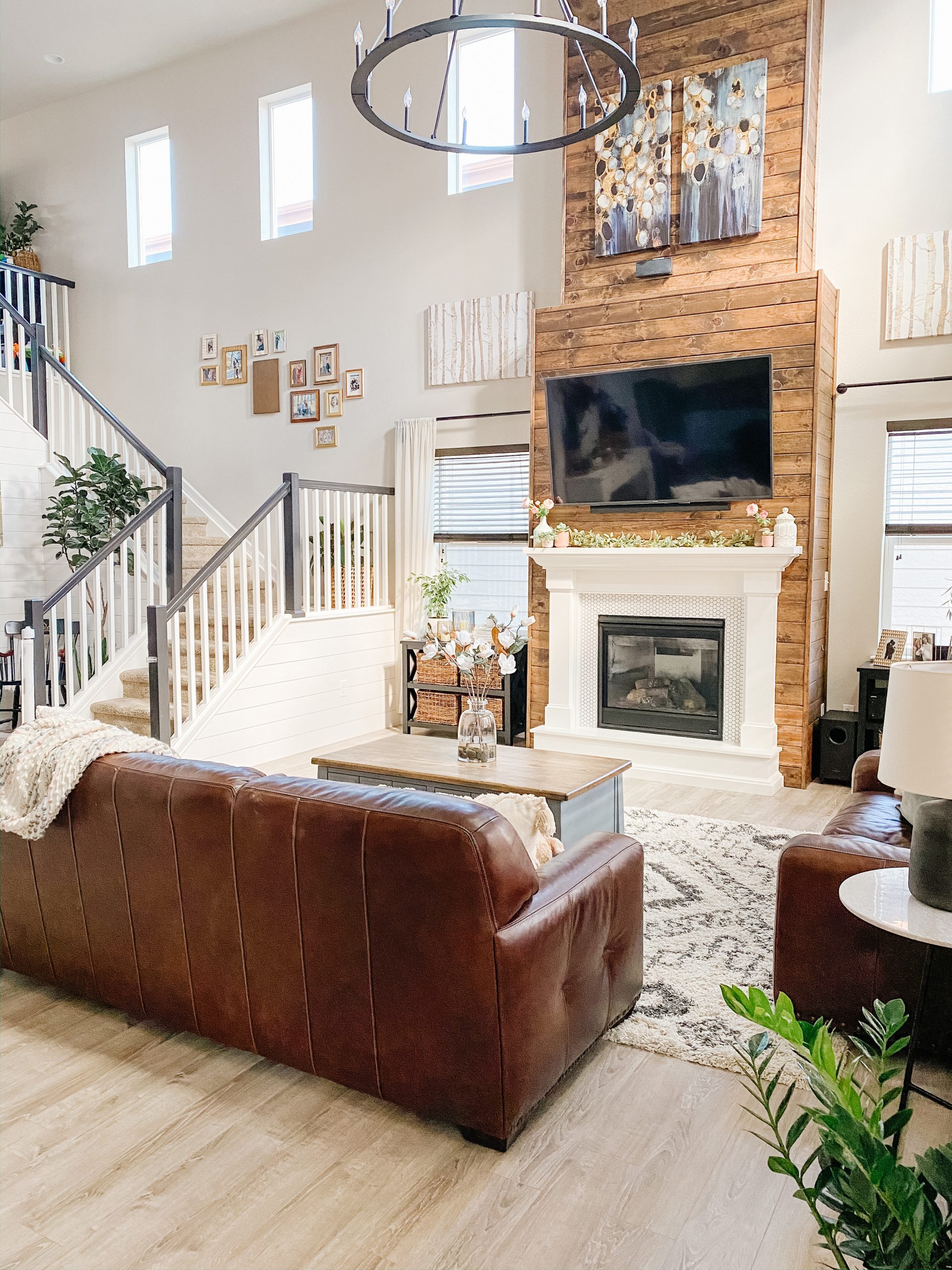 living room fireplace design with stained wood shiplap