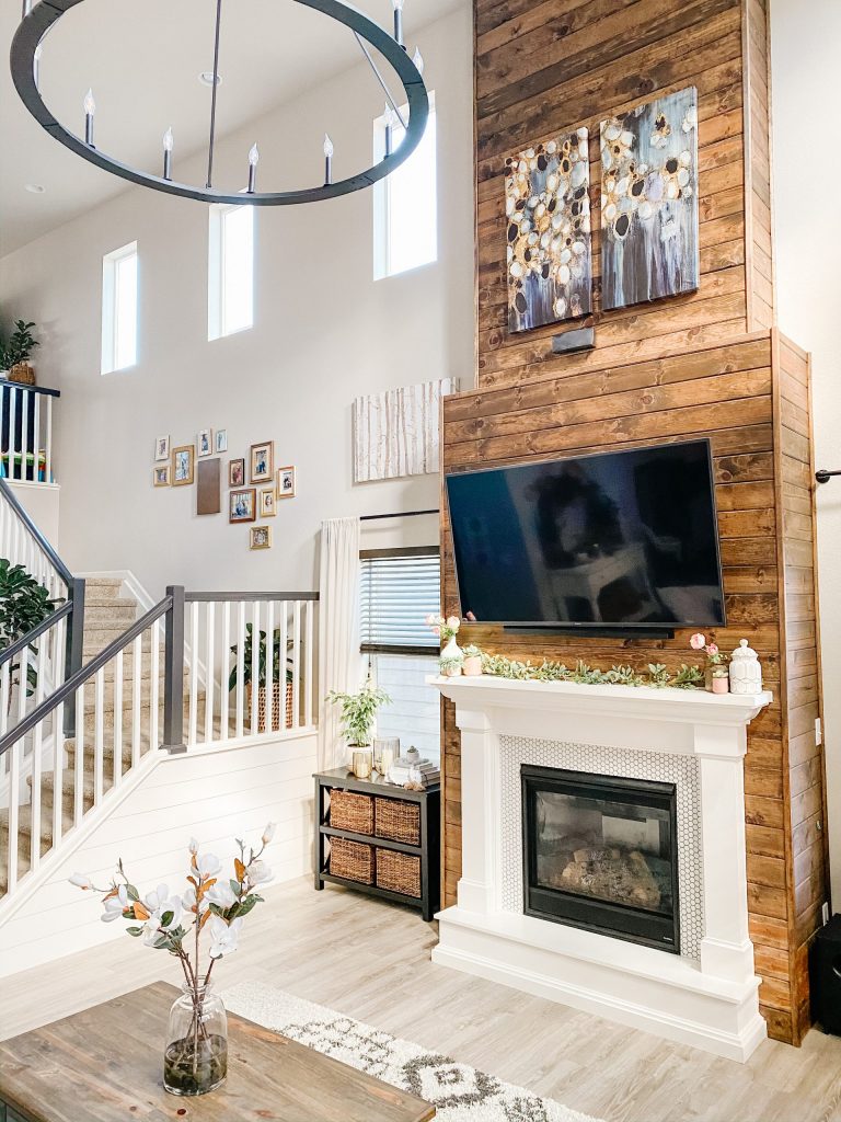 living room fireplace wall design with stained wood shiplap