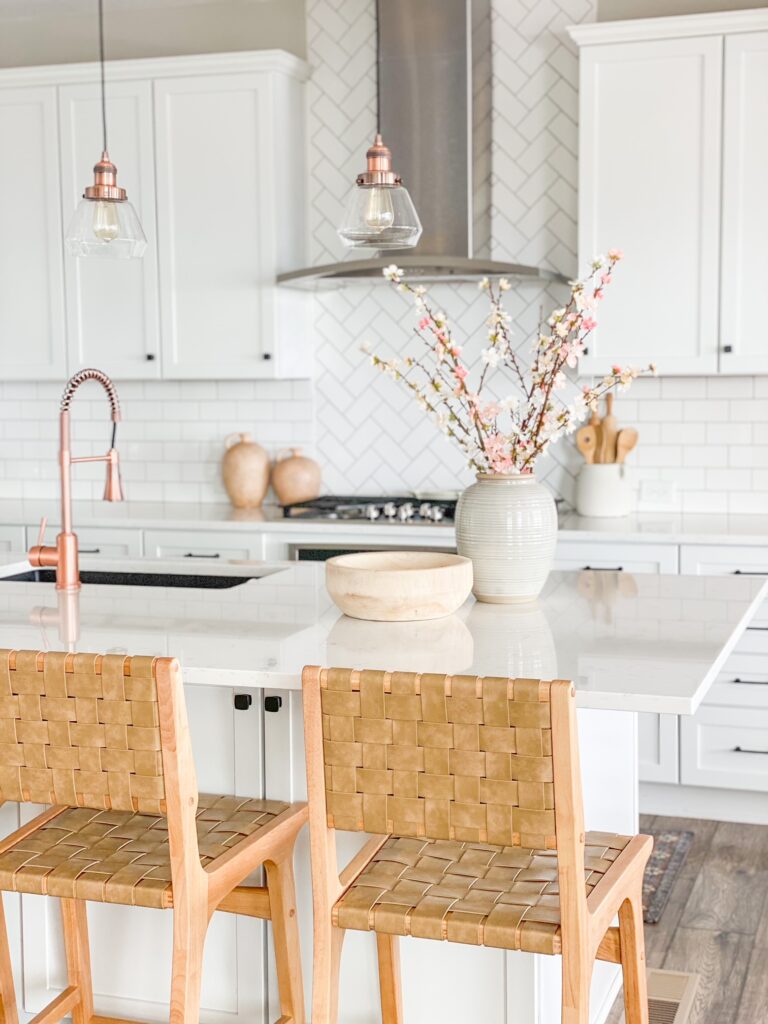 Spring florals add a pop of color to al all white kitchen! 