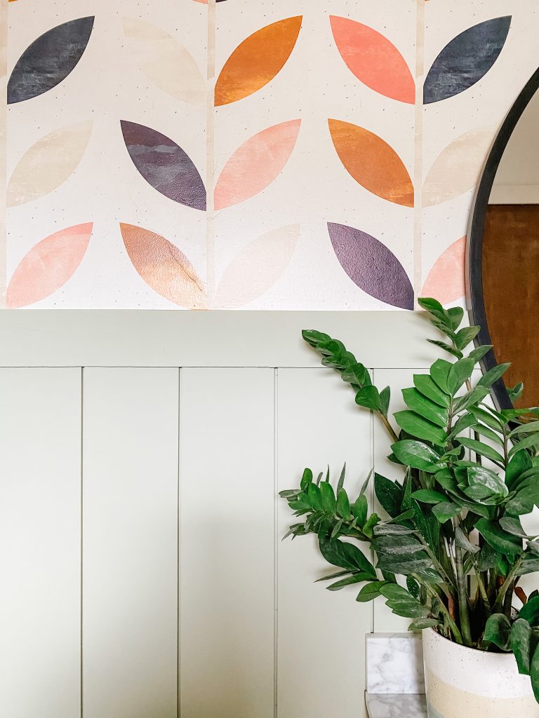 bathroom remodel with boho wallpaper and sage green vertical shiplap