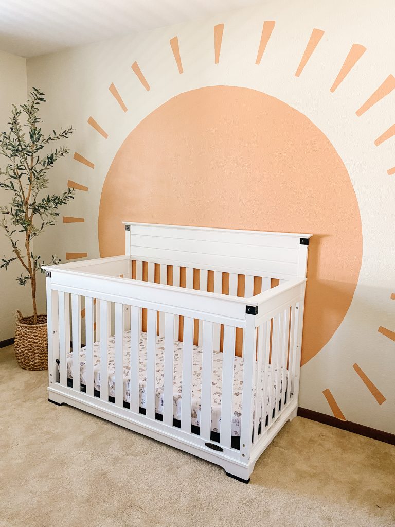 Boho Gender Neutral Nursery decor with faux olive tree and sun mural
