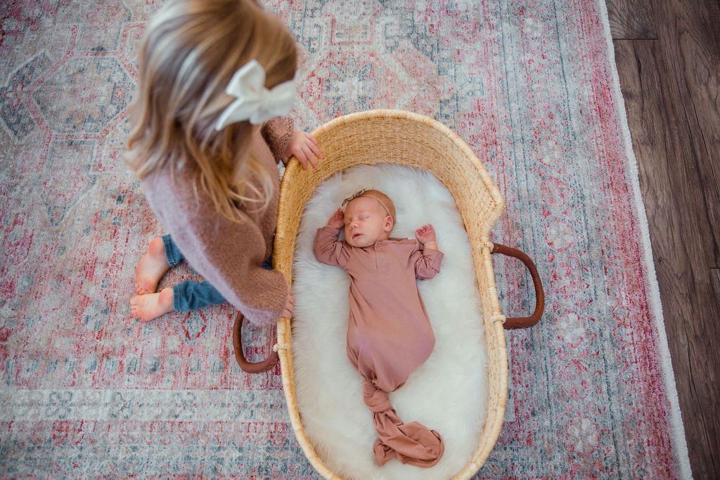 It is okay to have color throughout the room, which is why it is important to have neutral, saturated clothing in your newborn photos!