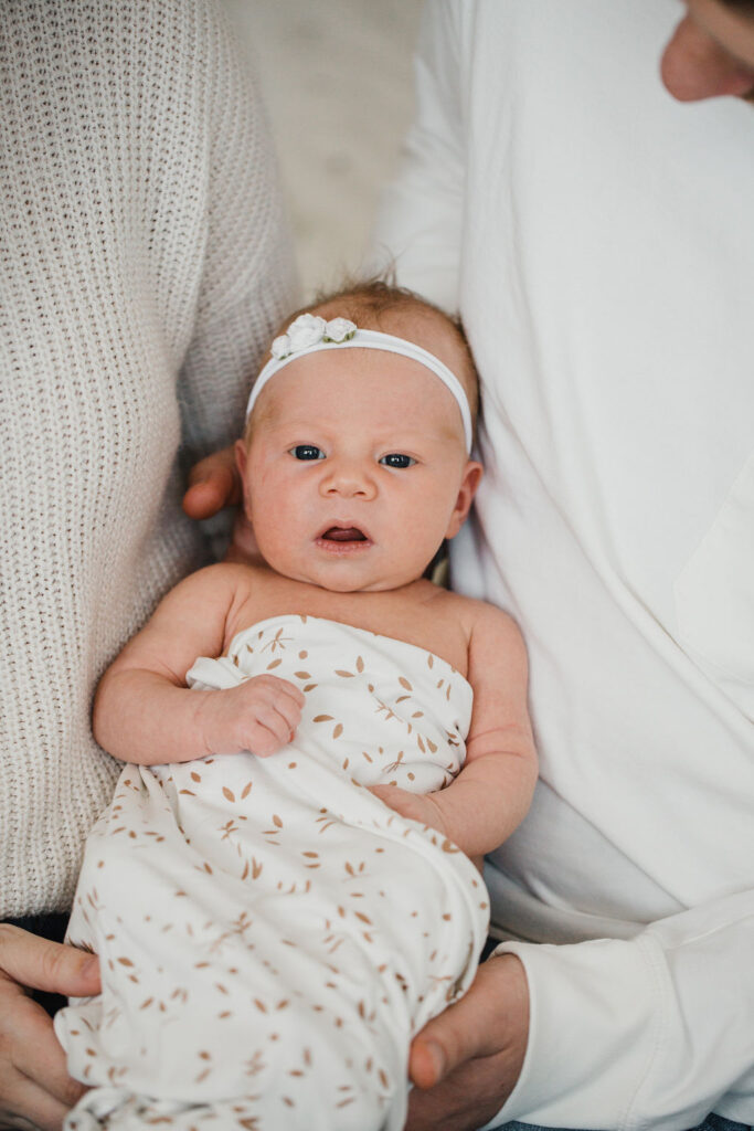 Don't worry if baby doesn't stay swaddled, the newborn pictures will turn out cute either way!