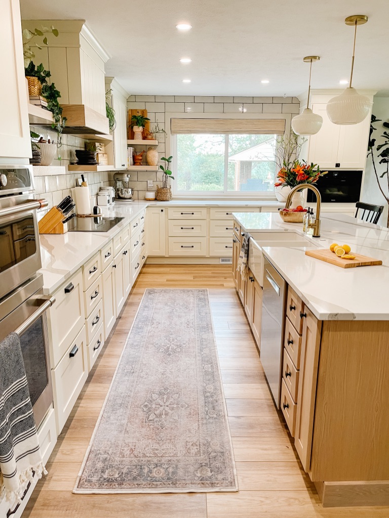 1970s kitchen remodel with cream cabinets and white oak island cabinets