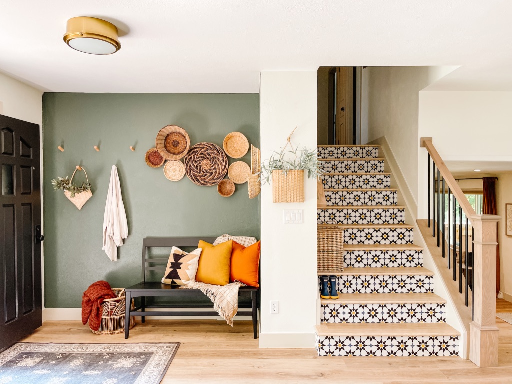 Colorful DIY Stair Risers with Peel and Stick Wallpaper and Dark Green Accent Wall