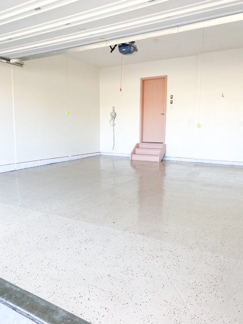 https://sprucingupmamahood.com/wp-content/uploads/2021/09/simple-garage-epoxy-floor.jpg