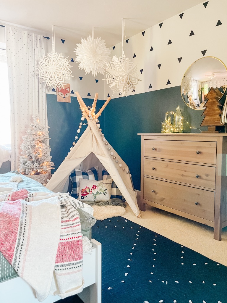DIY canvas teepee with large snowflake paper lanterns above and 3' flocked christmas tree in Colorful & Whimsical Christmas Kid's Bedroom