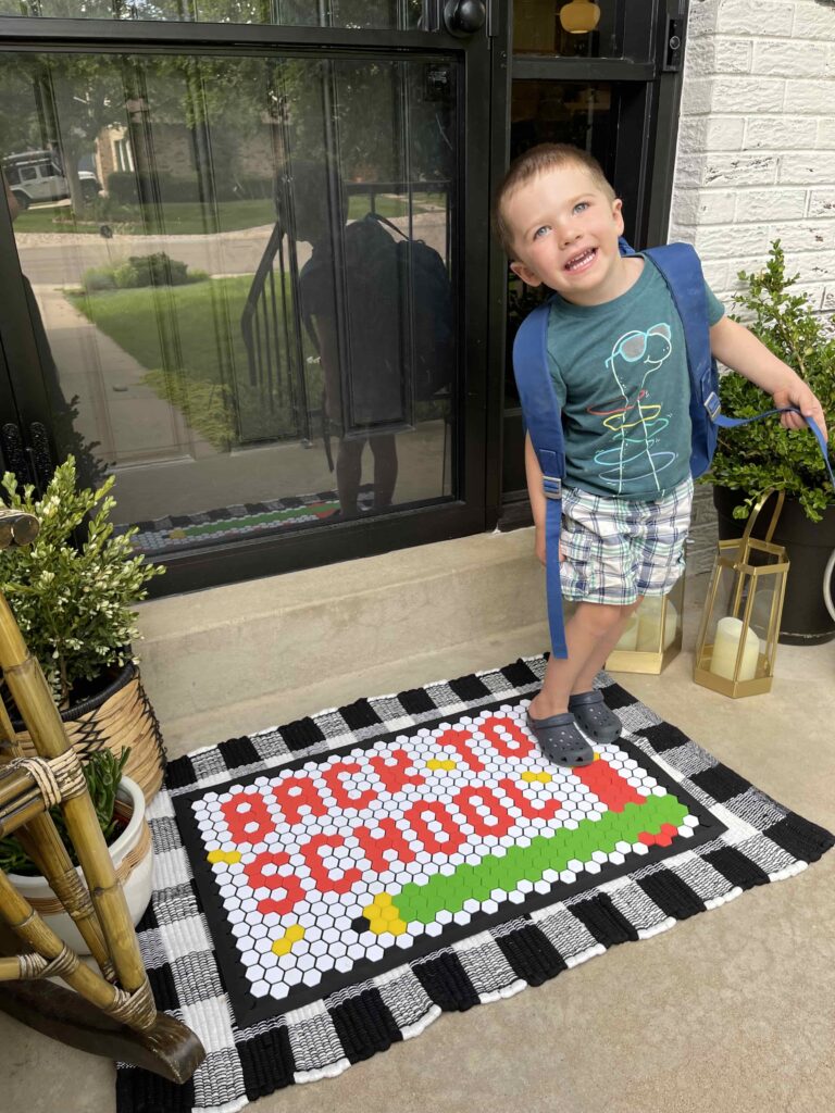 first day of school photo with letterfolk tile mat