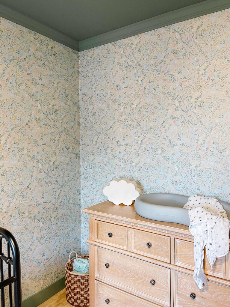 Colorful Boy Nursery with Wallpaper and Contrast Trim